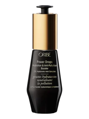 Frasco de cristal oscuro de Oribe Power Drops Hydration & Anti-Pollution Booster con dosificador de precisión dorado.