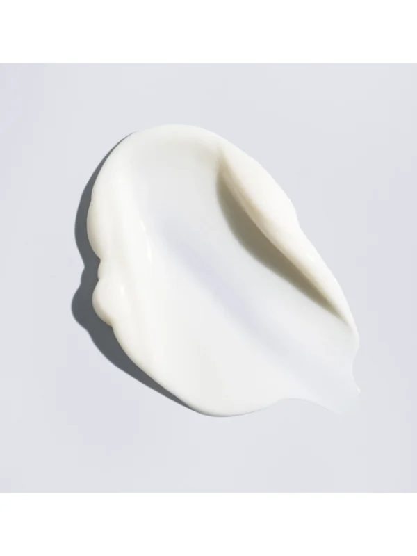 Muestra de la textura rica y cremosa de color blanco de la Oribe Supershine Moisturizing Cream.