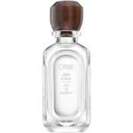 Presentación elegante de la fragancia Oribe Côte d’Azur Eau de Parfum sobre fondo blanco neutro.