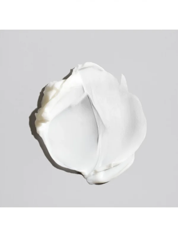 Detalle de la textura con fibras elásticas de Oribe Fiber Groom Elastic Texture Paste