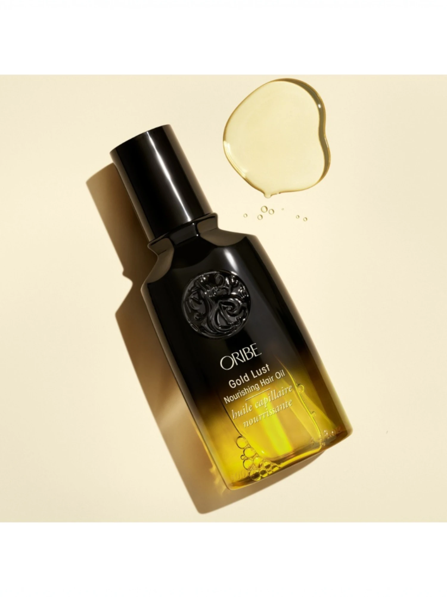 Aceite nutritivo Oribe Gold Lust con textura ligera y acabado brillante