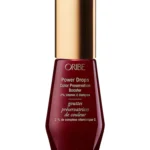 Envase frontal de Oribe Power Drops Color Preservation Booster de 30 ml, sérum concentrado protector del color