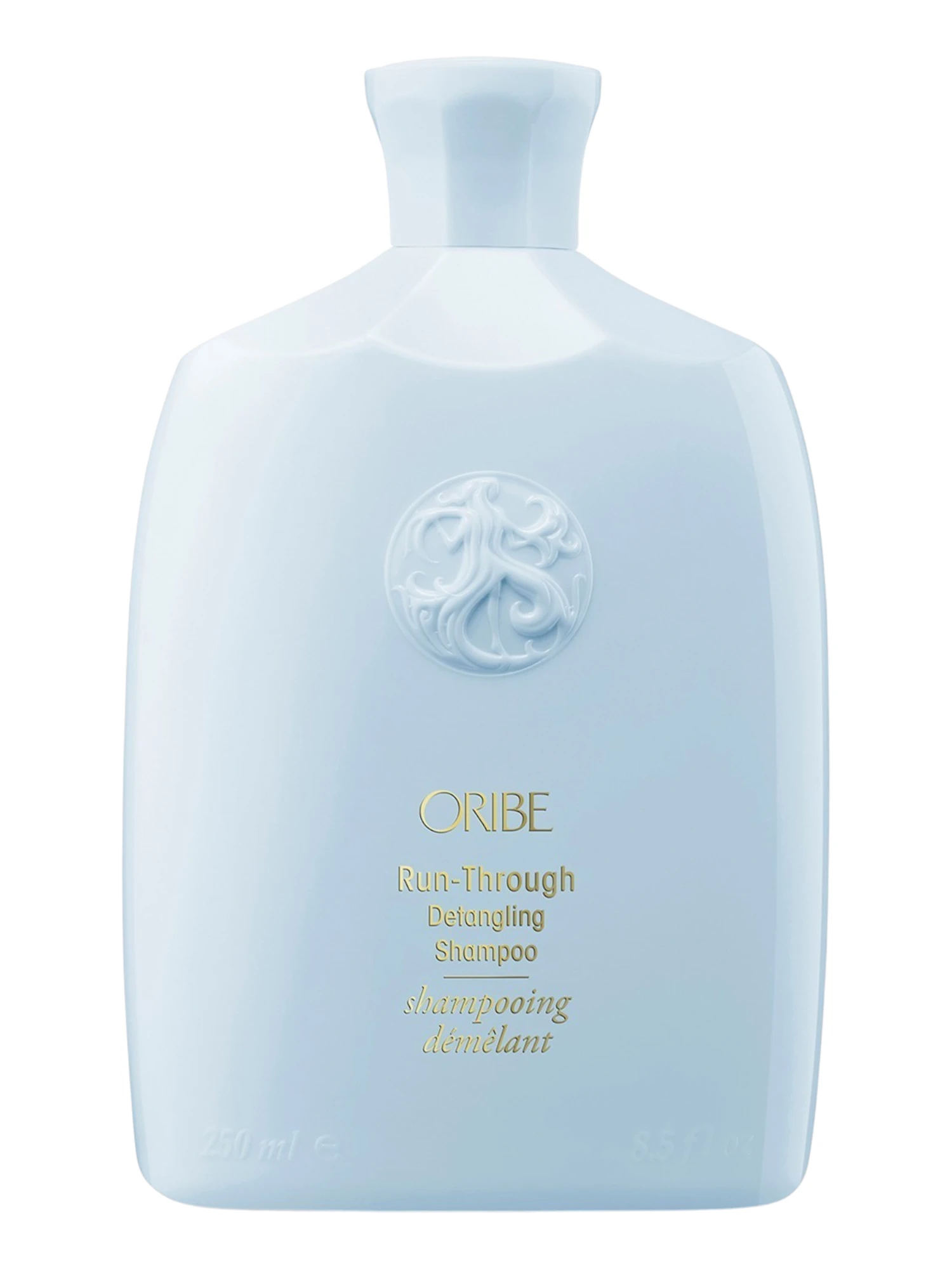 Presentación del envase de Oribe Run-Through Detangling Shampoo de 250 ml.