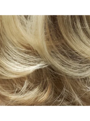 Primer plano de la textura y el cuerpo del cabello tratado con el spray densificador de la línea Magnificent Volume