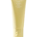 Acondicionador fortalecedor Hair Alchemy de Oribe en envase original sobre fondo claro