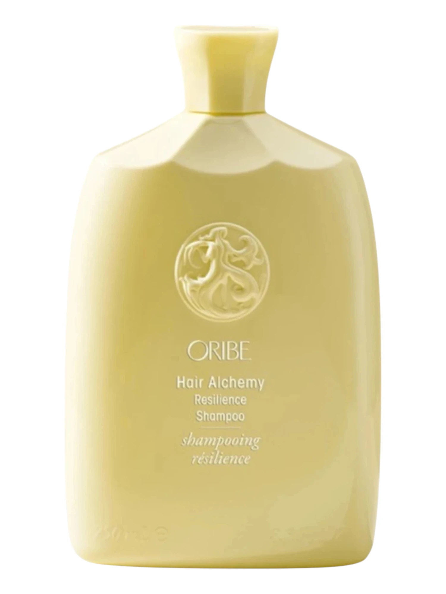 Champú fortalecedor Hair Alchemy de Oribe en envase original sobre fondo claro