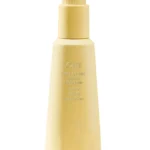 Bálsamo de peinado sin calor Hair Alchemy de Oribe en envase original sobre fondo claro