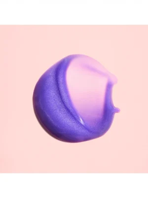 Textura violeta Oribe Bright Blonde Essential Priming Serum para neutralizar tonos amarillos en cabello rubio
