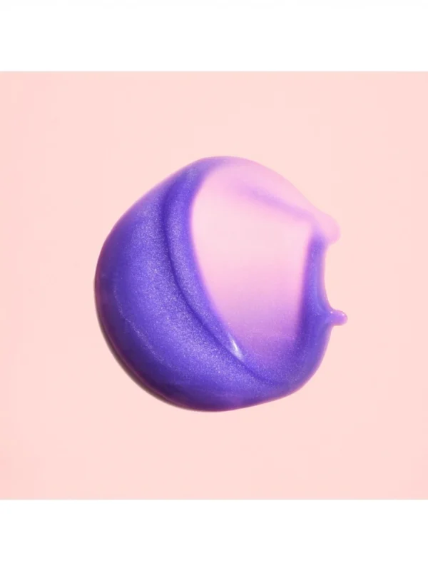 Textura violeta Oribe Bright Blonde Essential Priming Serum para neutralizar tonos amarillos en cabello rubio